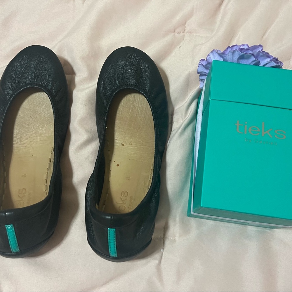 Like new black Tieks size 8 with flower box and bag